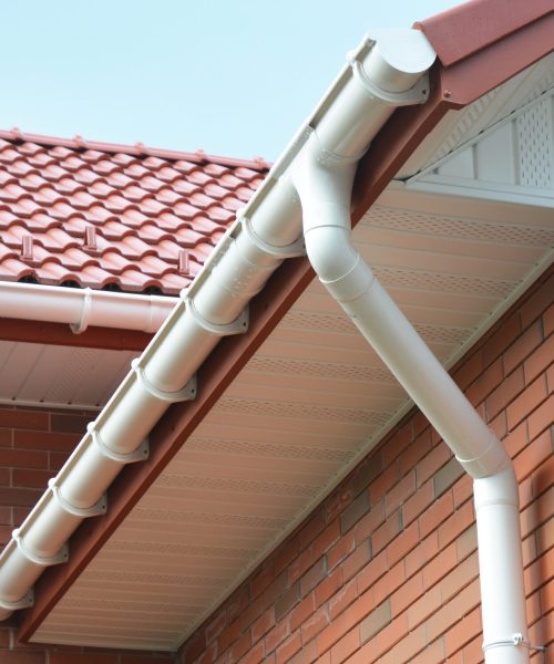 Close up view on House Problem Areas for Rain Gutter Waterproofing Outdoor. Home Guttering, Gutters, Plastic Guttering System, Guttering & Drainage Pipe Exterior